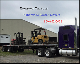 Two forklifts secured on a transport trailer
