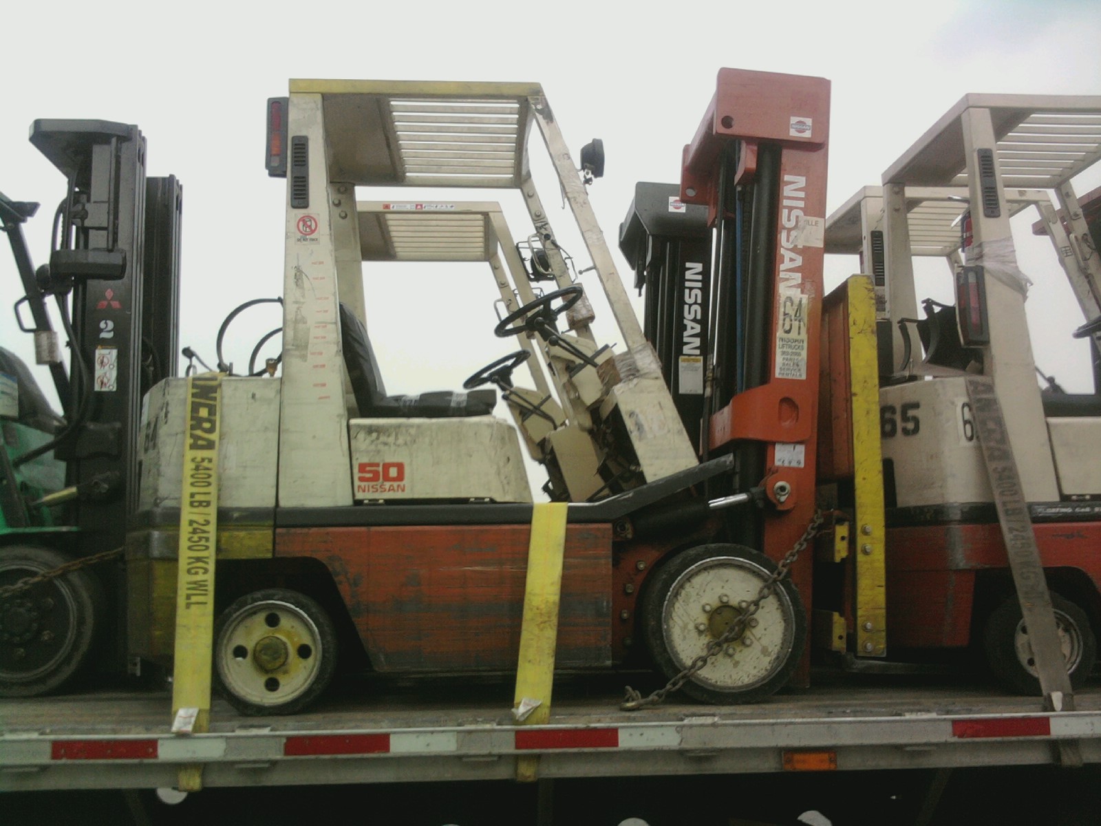 Forklift hauling service on a flatbed